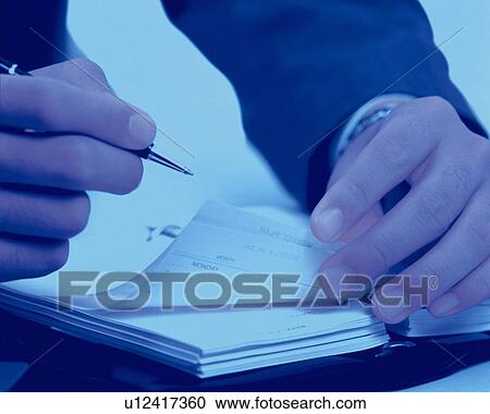 Hand writing down on a scheduler, Close Up, Toned Image View Large Photo Image Stock Image - Hand writing down on a scheduler, Close Up, Toned Image. Fotosearch