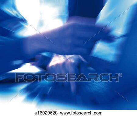 Hands working with a computer at the desk, Toned Image, Blurred Motion View Large Photo Image Stock Photo - Hands working with a computer at the desk, Toned Image, Blurred Motion. Fotosearch