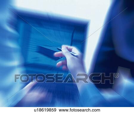 Stock Photo - Three people working together with a computer at the desk, Portrait, Rear View, Toned Image, Blurred Motion. Fotosearch