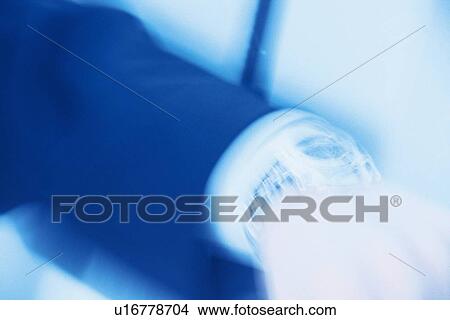 Arm of businessman wearing a watch, close up, toned image, blurred motion, Tokyo, Japan View Large Photo Image Picture - Arm of businessman wearing a watch, close up, toned image, blurred motion, Tokyo, Japan. Fotosearch