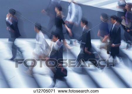 Business people crossing at the crosswalk, high angle view, blurred motion, Tokyo, Japan View Large Photo Image Stock Image - Business people crossing at the crosswalk, high angle view, blurred motion, Tokyo, Japan. Fotosearch