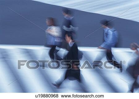 Business people crossing at the crosswalk, high angle view, blurred motion, Tokyo, Japan View Large Photo Image Stock Photo - Business people crossing at the crosswalk, high angle view, blurred motion, Tokyo, Japan. Fotosearch