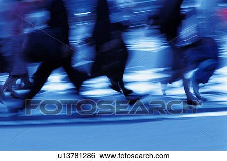 Business people crossing at the crosswalk, side view, blurred motion, Tokyo, Japan View Large Photo Image Stock Photograph - Business people crossing at the crosswalk, side view, blurred motion, Tokyo, Japan. Fotosearch