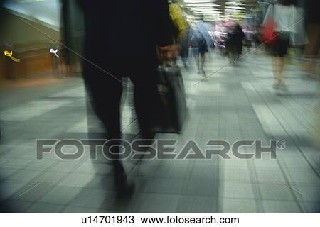 Business people walking down street, rear view, blurred motion, Tokyo, Japan View Large Photo Image Stock Image - Business people walking down street, rear view, blurred motion, Tokyo, Japan. Fotosearch