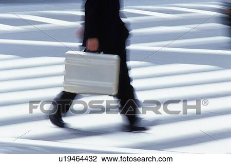 Businessman crossing at the crosswalk, side view, blurred motion, Tokyo, Japan View Large Photo Image Stock Image - Businessman crossing at the crosswalk, side view, blurred motion, Tokyo, Japan. Fotosearch