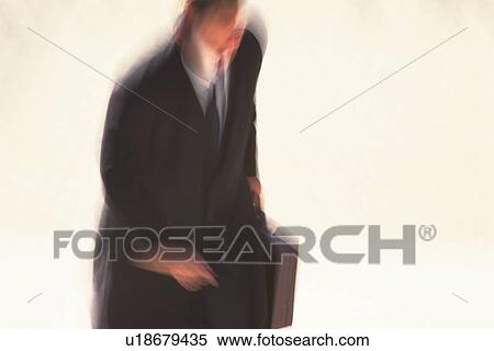Businessman holding briefcase, high angle view, blurred motion, Tokyo, Japan View Large Photo Image Stock Photography - Businessman holding briefcase, high angle view, blurred motion, Tokyo, Japan. Fotosearch
