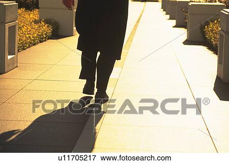 Businessman walking down street, low section, Tokyo, Japan View Large Photo Image Stock Photo - Businessman walking down street, low section, Tokyo, Japan. Fotosearch