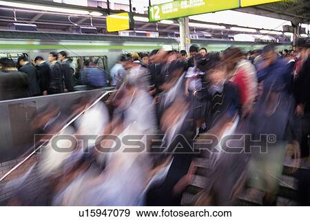 People at station, high angle view, blurred motion, Tokyo, Japan View Large Photo Image Stock Photo - People at station, high angle view, blurred motion, Tokyo, Japan. Fotosearch