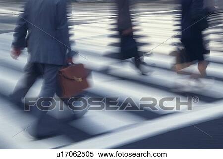 Stock Photography - People crossing at the crosswalk, high angle view, blurred motion, Tokyo, Japan. Fotosearch