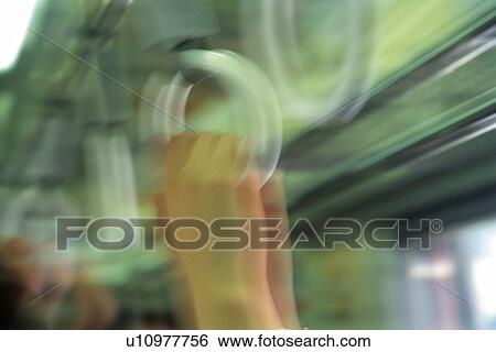 People hanging on to straps, close up, blurred motion, Tokyo, Japan View Large Photo Image Stock Photograph - People hanging on to straps, close up, blurred motion, Tokyo, Japan. Fotosearch