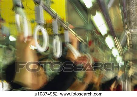 People hanging on to straps, low angle view, blurred motion, Tokyo, Japan View Large Photo Image Stock Image - People hanging on to straps, low angle view, blurred motion, Tokyo, Japan. Fotosearch