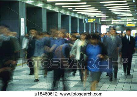 People walking down passage in station, blurred motion, Tokyo, Japan View Large Photo Image Stock Image - People walking down passage in station, blurred motion, Tokyo, Japan. Fotosearch