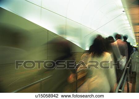 People walking down passage, rear view, blurred motion, Tokyo, Japan View Large Photo Image Stock Image - People walking down passage, rear view, blurred motion, Tokyo, Japan. Fotosearch