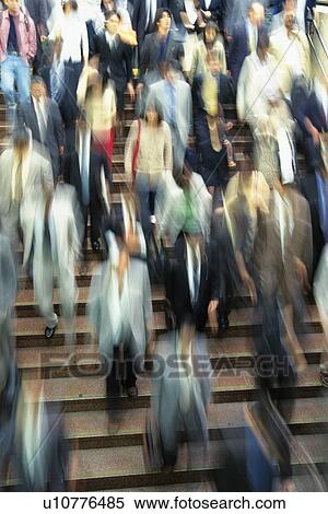 People walking down stairs at station, high angle view, blurred motion, Tokyo, Japan View Large Photo Image Stock Photography - People walking down stairs at station, high angle view, blurred motion, Tokyo, Japan. Fotosearch