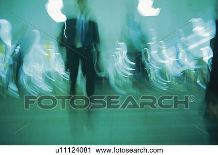 Stock Image - People walking down stairs, low angle view, blurred motion, Tokyo, Japan. Fotosearch