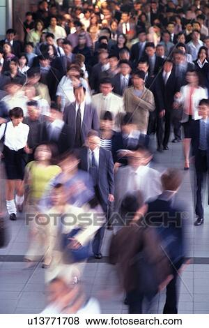 Stock Photo - People walking down the street, blurred motion, Tokyo, Japan. Fotosearch