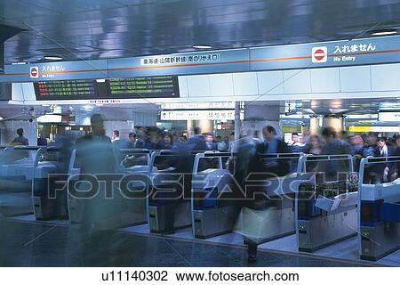 People walking through automatic ticket wicket at station, blurred motion, Tokyo, Japan View Large Photo Image Stock Image - People walking through automatic ticket wicket at station, blurred motion, Tokyo, Japan. Fotosearch