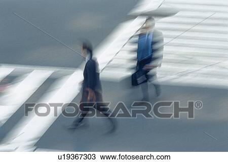 Two men crossing at the crosswalk, high angle view, blurred motion, Tokyo, Japan View Large Photo Image Stock Image - Two men crossing at the crosswalk, high angle view, blurred motion, Tokyo, Japan. Fotosearch