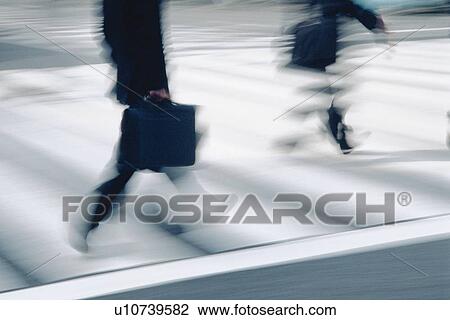 Two men crossing at the crosswalk, side view, blurred motion, Tokyo, Japan View Large Photo Image Stock Image - Two men crossing at the crosswalk, side view, blurred motion, Tokyo, Japan. Fotosearch