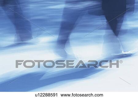 Two men walking down the street, low section, blurred motion, Tokyo, Japan View Large Photo Image Stock Image - Two men walking down the street, low section, blurred motion, Tokyo, Japan. Fotosearch