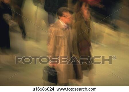 Business people walking down on street, high angle view, blurred motion, New York City, NY, USA View Large Photo Image Picture - Business people walking down on street, high angle view, blurred motion, New York City, NY, USA. Fotosearch