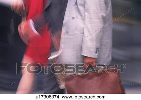 Picture - Business people walking down on street, side view, blurred motion, New York City, NY, USA. Fotosearch