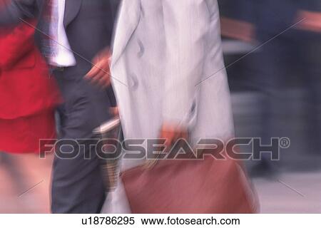 Business people walking down the street, side view, blurred motion, New York City, NY, USA View Large Photo Image Stock Photography - Business people walking down the street, side view, blurred motion, New York City, NY, USA. Fotosearch