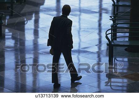 Businessman standing with hands in pocket, high angle view, New York City, NY, USA View Large Photo Image Stock Photo - Businessman standing with hands in pocket, high angle view, New York City, NY, USA. Fotosearch