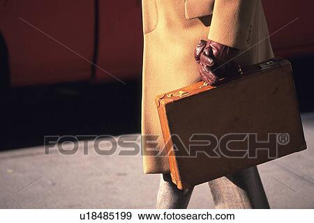 Businessman walking and holding a briefcase, side view, New York City, NY, USA View Large Photo Image Stock Photo - Businessman walking and holding a briefcase, side view, New York City, NY, USA. Fotosearch