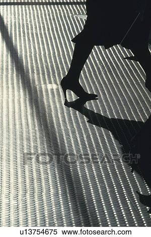 Businesswoman walking on metal floor, high angle view, New York City, NY, USA View Large Photo Image Stock Photography - Businesswoman walking on metal floor, high angle view, New York City, NY, USA. Fotosearch