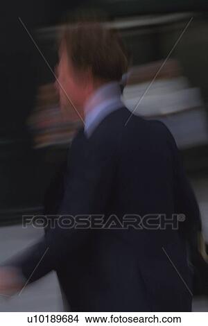 Running businessman, side view, blurred motion, New York City, NY, USA View Large Photo Image Picture - Running businessman, side view, blurred motion, New York City, NY, USA. Fotosearch