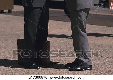 Two men standing on the street, side view, New York City, NY, USA View Large Photo Image Stock Photograph - Two men standing on the street, side view, New York City, NY, USA. Fotosearch