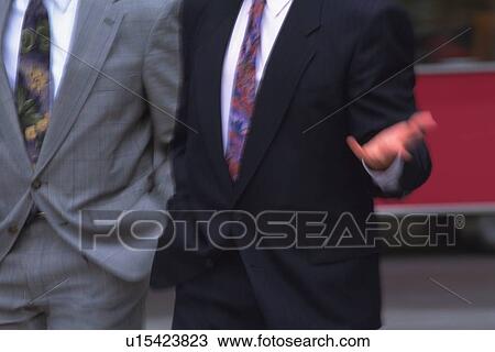 Two men walking side by side, front view, blurred motion, New York City, NY, USA View Large Photo Image Stock Image - Two men walking side by side, front view, blurred motion, New York City, NY, USA. Fotosearch