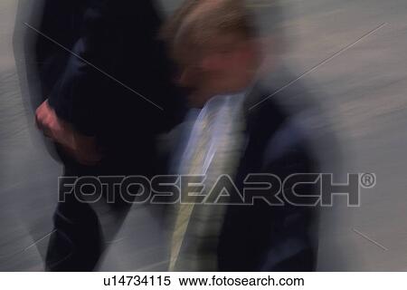 Two men walking side by side, high angle view, blurred motion, New York City, NY, USA View Large Photo Image Stock Photography - Two men walking side by side, high angle view, blurred motion, New York City, NY, USA. Fotosearch