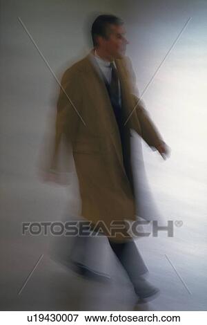 Walking businessman, high angle view, blurred motion, New York City, NY, USA View Large Photo Image Stock Photo - Walking businessman, high angle view, blurred motion, New York City, NY, USA. Fotosearch