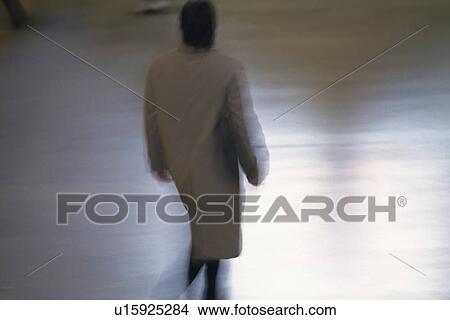 Picture - Walking businessman, rear view, New York City, NY, USA. Fotosearch