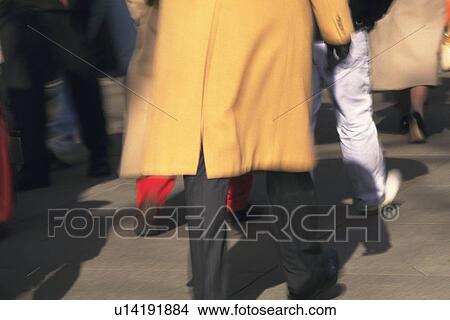 Walking people, rear view, blurred motion, New York City, NY, USA View Large Photo Image Picture - Walking people, rear view, blurred motion, New York City, NY, USA. Fotosearch
