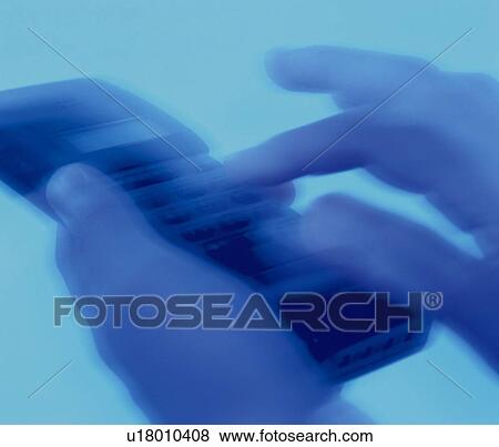 Businessman holding a mobile phone and pushing buttons, close up, high angle view, toned image View Large Photo Image Stock Photo - Businessman holding a mobile phone and pushing buttons, close up, high angle view, toned image. Fotosearch