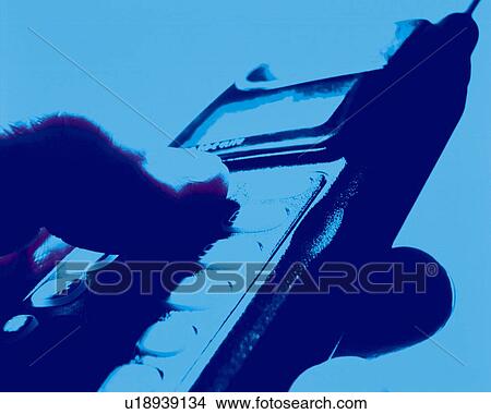 Picture - Businessman holding a mobile phone, close up, toned image. Fotosearch