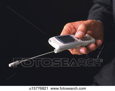 Businessman pushing buttons of mobile phone, side view View Large Photo Image Stock Image - Businessman pushing buttons of mobile phone, side view. Fotosearch