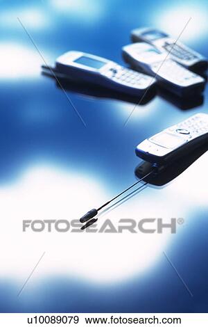 Four mobile phones, high angle view, soft focus View Large Photo Image Stock Photo - Four mobile phones, high angle view, soft focus. Fotosearch