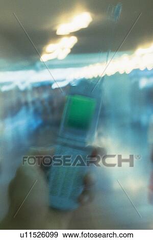Holding a Mobile Phone, Front View, Blurred Motion View Large Photo Image Stock Photo - Holding a Mobile Phone, Front View, Blurred Motion. Fotosearch