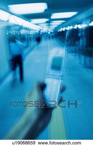 Holding a Mobile Phone, Front View, Blurred Motion View Large Photo Image Stock Photo - Holding a Mobile Phone, Front View, Blurred Motion. Fotosearch