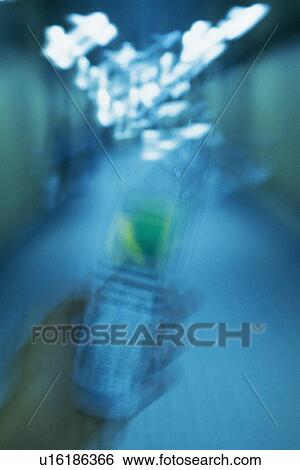 Holding a Mobile Phone, Front View, Blurred Motion View Large Photo Image Stock Photograph - Holding a Mobile Phone, Front View, Blurred Motion. Fotosearch