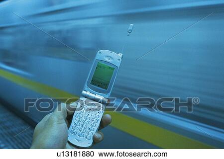 Holding a Mobile Phone, High Angle View View Large Photo Image Stock Image - Holding a Mobile Phone, High Angle View. Fotosearch