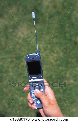 Holding a Mobile Phone, High Angle View View Large Photo Image Stock Image - Holding a Mobile Phone, High Angle View. Fotosearch