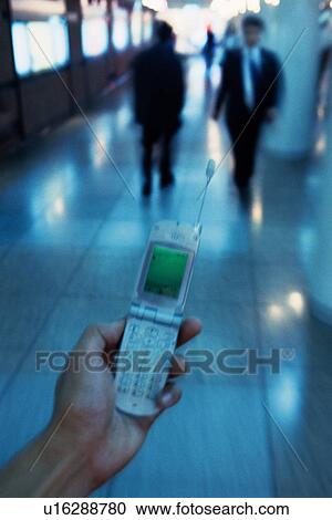 Holding a Mobile Phone, High Angle View View Large Photo Image Stock Image - Holding a Mobile Phone, High Angle View. Fotosearch