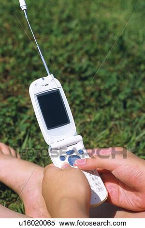 Holding a Mobile Phone, High Angle View View Large Photo Image Stock Photography - Holding a Mobile Phone, High Angle View. Fotosearch