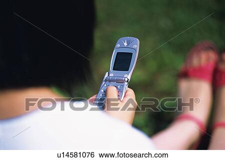 Holding a Mobile Phone, Rear View View Large Photo Image Stock Photograph - Holding a Mobile Phone, Rear View. Fotosearch