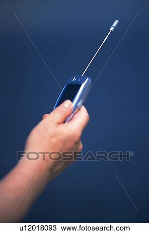 Holding a Mobile Phone, Side View View Large Photo Image Stock Image - Holding a Mobile Phone, Side View. Fotosearch